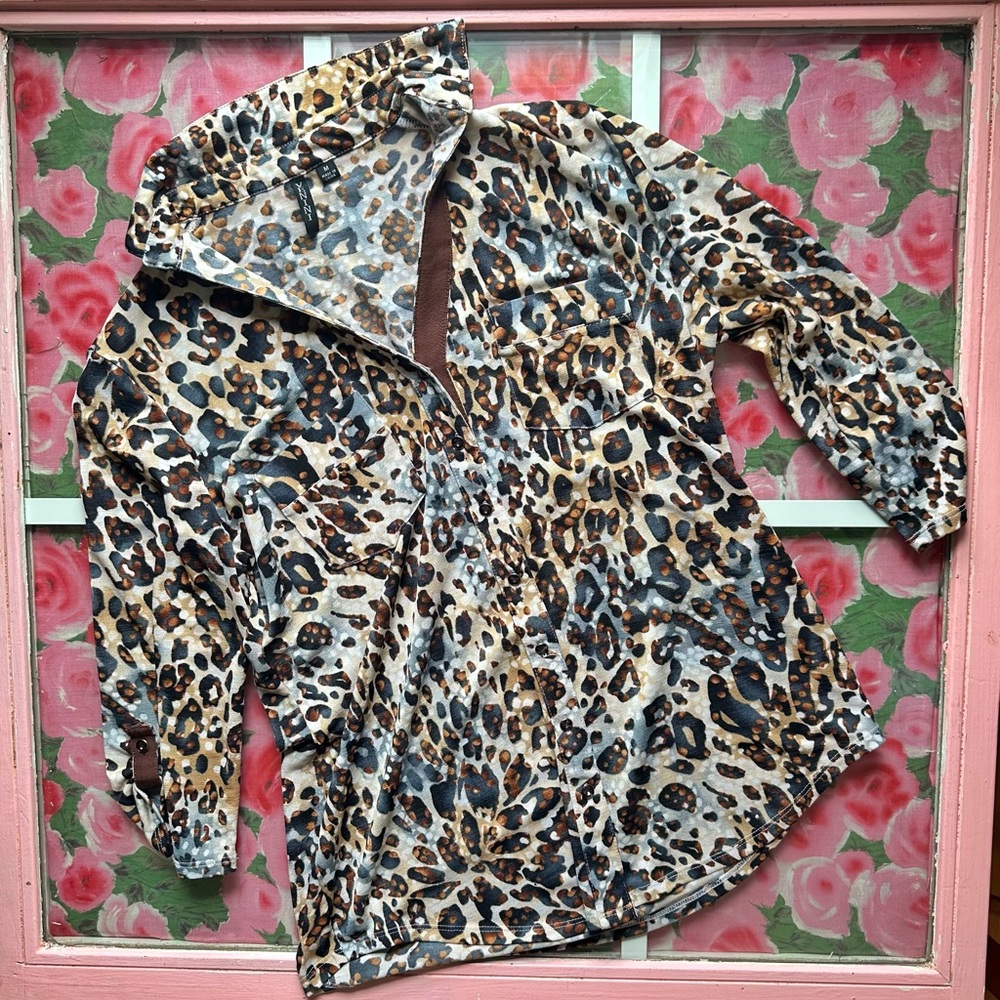 Leopard print button down with pockets. 95% polyester, 5% spandex